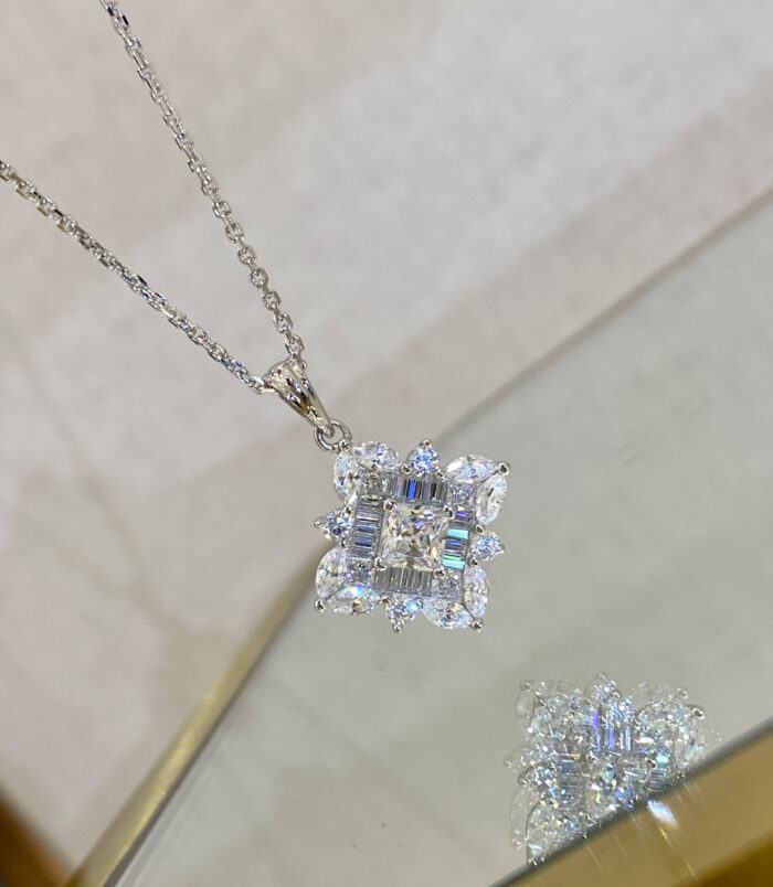 Dazzling Sterling Silver Snowflake Pendant Necklace reflected beautifully on a mirror