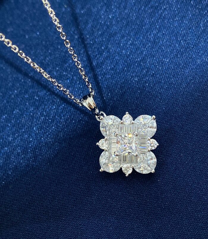 Dazzling Sterling Silver Snowflake Pendant Necklace display in dark blue jewelry box