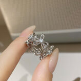 hand held close-up of Romantic Floral Design Sterling Silver Ring