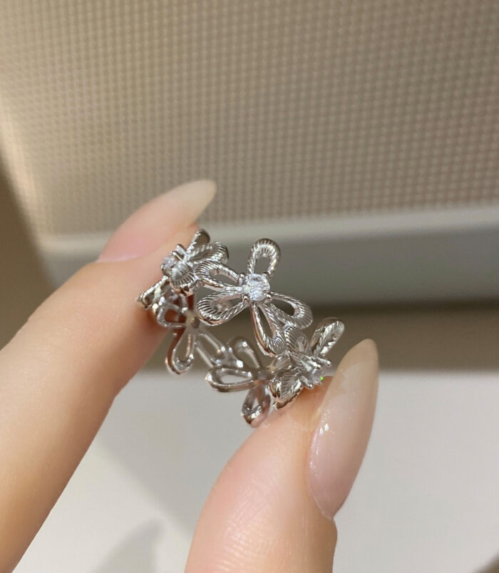 hand held close-up of Romantic Floral Design Sterling Silver Ring