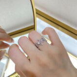 Romantic Floral Design Sterling Silver Ring worn on a model's finger