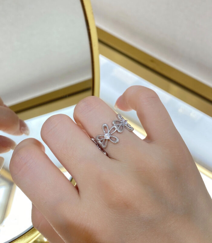 Romantic Floral Design Sterling Silver Ring worn on a model's finger