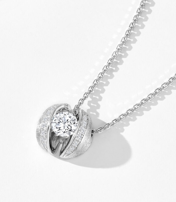 side view close-up of Rhodium plated Sterling silver brushed calla lily necklace