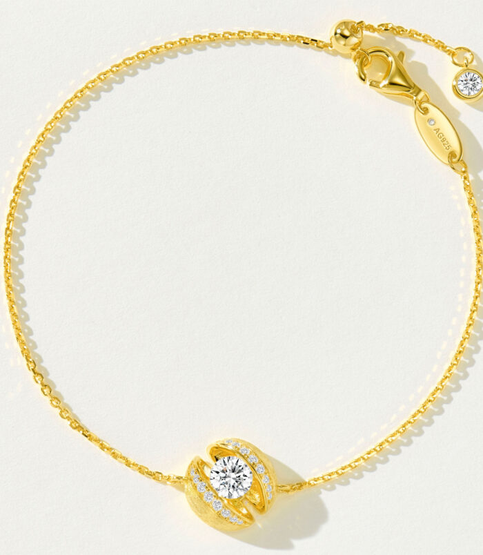 Gold-Plated 925 Silver Bracelet | Cubic Zirconia Centerpiece | Adjustable Chain full view Gold-plated 925 silver bracelet with a round cubic zirconia centerpiece, adjustable chain, and lobster clasp.