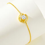 side view of a gold plated silver bracelet with sparkling cubic zirconia stones