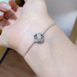 sleek white gold color calla lily silver bracelet worn on wrist