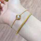 warm gold color calla lily bracelet worn on wrist