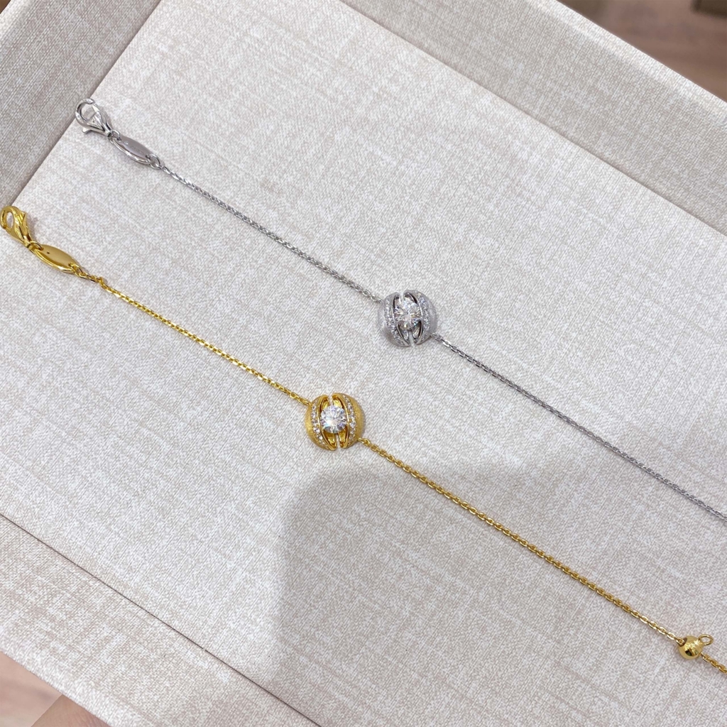 side by side comparison of calla lily silver bracelet: rhodium plated white gold vs. gold plated yellow gold