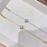 side by side comparison of calla lily silver bracelet: rhodium plated white gold vs. gold plated yellow gold