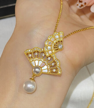 Sterling silver openwork fan necklace handheld details hand held close-up of Sterling silver openwork fan necklace