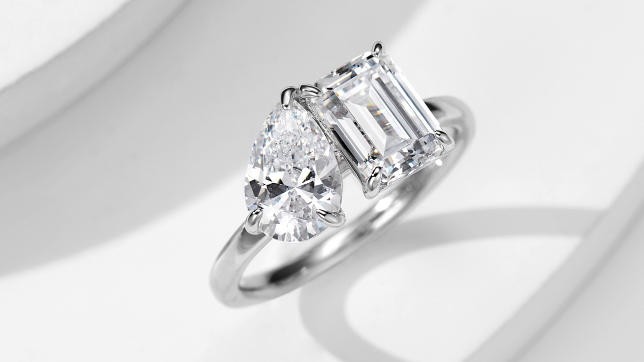 A Pear and Emerald Cut Two-Stone Ring