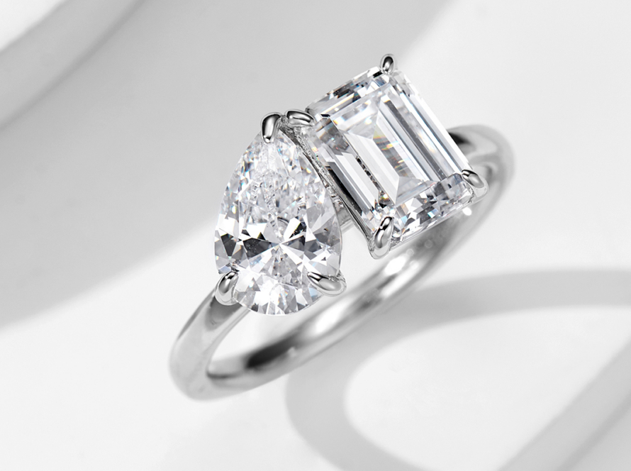 A Pear and Emerald Cut Two-Stone Ring